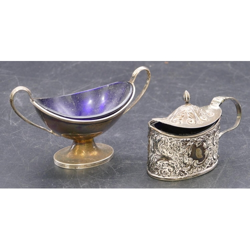 360 - A London silver boat shaped salt with blue glass liner on oval sweeping base and a Sheffield silver ... 