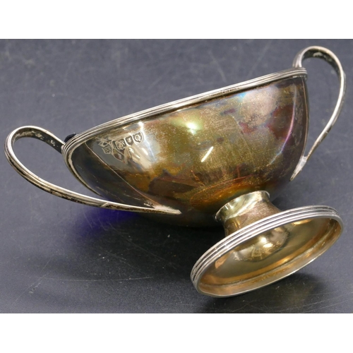 360 - A London silver boat shaped salt with blue glass liner on oval sweeping base and a Sheffield silver ... 