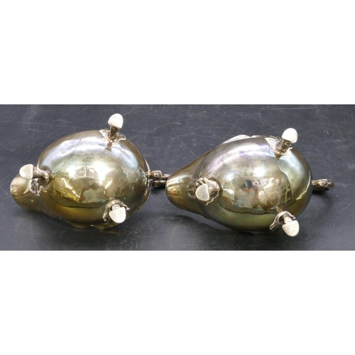 362 - A pair of early Victorian silver sauce boats engraved with crests and with crinkled rims, scroll han... 