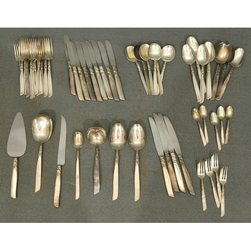 364 - A Community plated art nouveau style flatware service comprising of 9 knives, 4 larger knives, 9 des... 