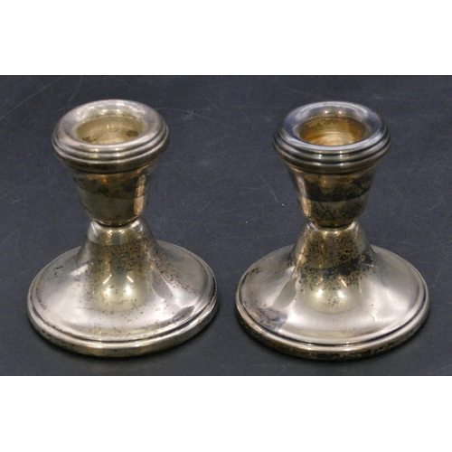 368 - A pair of Birmingham silver dwarf candlesticks on round sweeping bases, 6.8cm high.