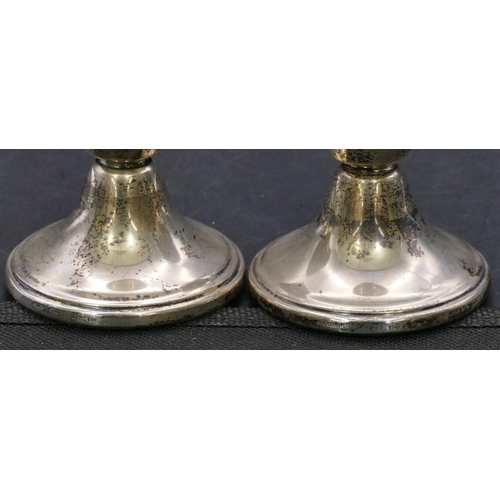 368 - A pair of Birmingham silver dwarf candlesticks on round sweeping bases, 6.8cm high.