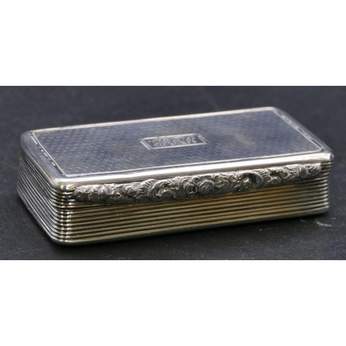 374 - A William IV silver rectangular shaped snuff box with allover engine turned decoration, hinged lid, ... 