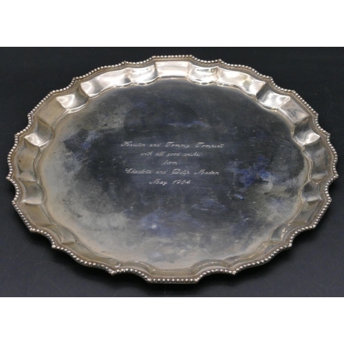 380 - A Continental silver coloured metal round pie crust salver with engraved description to center, 26.5... 