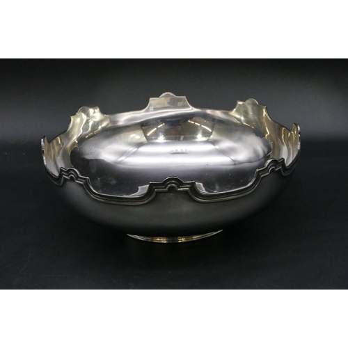 381 - A Continental silver coloured metal round bowl with scallop shaped rim, 22.2cm diameter, 16.3oz.