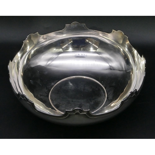 381 - A Continental silver coloured metal round bowl with scallop shaped rim, 22.2cm diameter, 16.3oz.