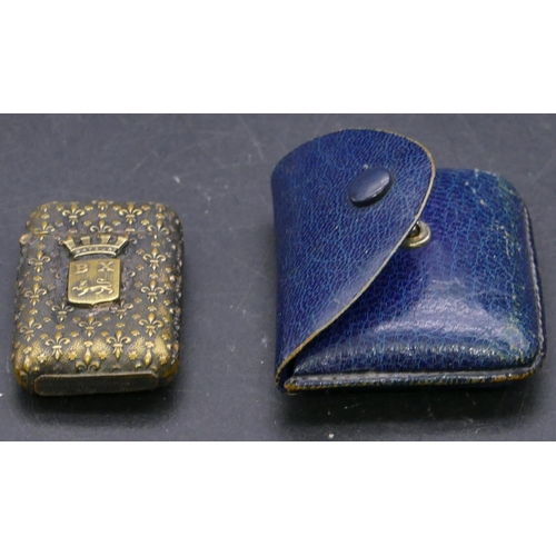 382 - A gilt silver plated vesta case with raised, embossed decoration and crest motif, hinged lid with bl... 