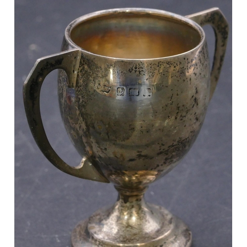 387 - A Birmingham silver small round bulbous 2-handled trophy, 8cm high, 1.4oz and a cut glass dressing t... 