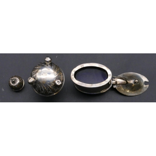 388 - An oval silver mustard pot with hinged lid enclosing blue glass liner (marks rubbed), a Birmingham s... 