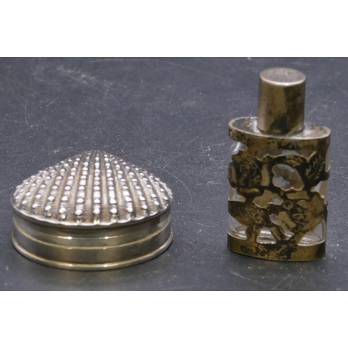 389 - A 925 silver pill box with hinged shell shaped top, 4.7cm wide and an Eastern silver coloured metal ... 