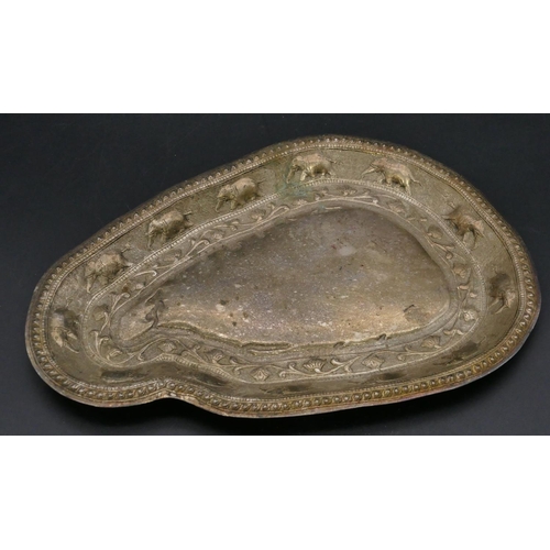 392 - An Eastern silver coloured metal scallop shaped tray with embossed elephant and scroll decoration, 3... 