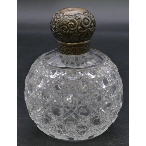 393 - An Edward VII cut glass round bulbous shaped scent bottle with silver screw lid with embossed floral... 