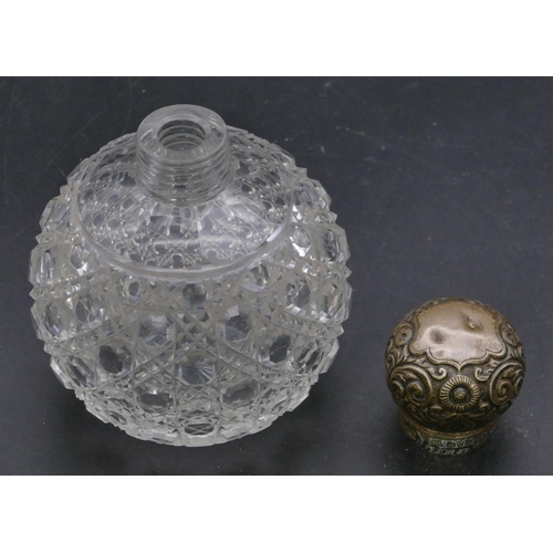 393 - An Edward VII cut glass round bulbous shaped scent bottle with silver screw lid with embossed floral... 