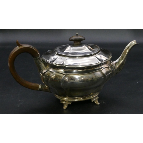 395 - A late Victorian oval silver teapot with wooden handle and finial on splayed feet, London, 1900, 22.... 