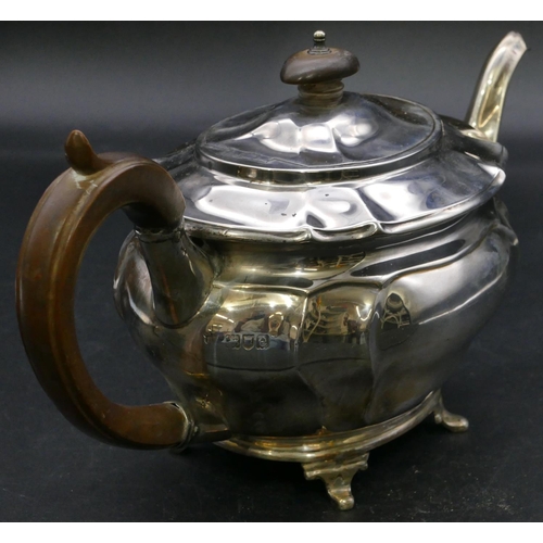 395 - A late Victorian oval silver teapot with wooden handle and finial on splayed feet, London, 1900, 22.... 