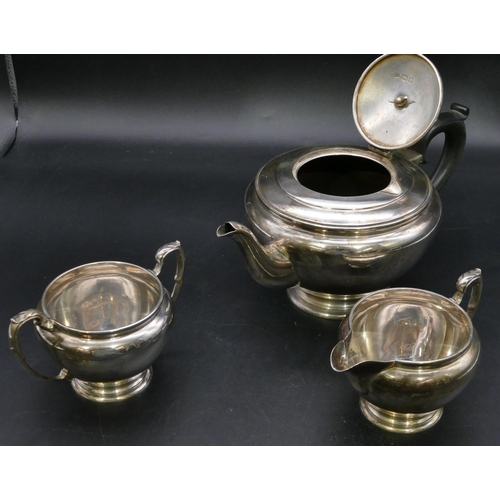 396 - An Edward VIII 3-piece silver round bulbous shaped tea service, comprising teapot with ebonised hand... 