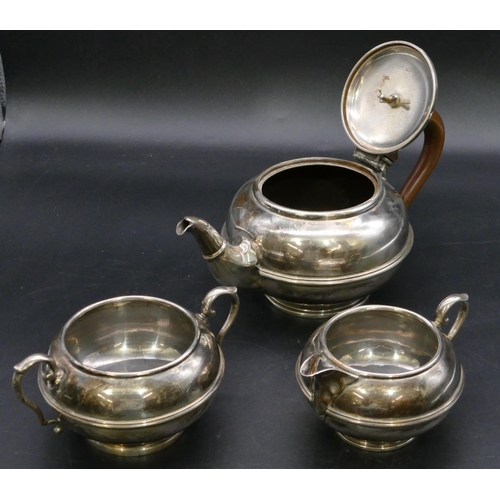 398 - A 3-piece George V silver round bulbous shaped tea service, comprising of teapot with wooden handle,... 