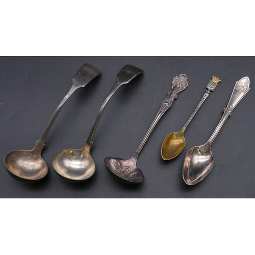 399 - A Continental silver gilt coloured metal teaspoon with crest motif, a silver coloured metal teaspoon... 