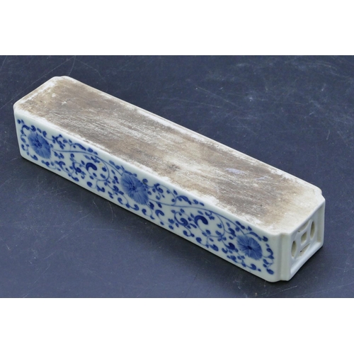 40 - An Oriental blue and white rectangular scroll weight with figure, landscape, floral and scroll decor... 