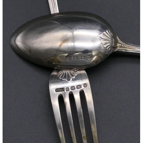 403 - A Victorian silver child's spoon, knife and fork with raised scroll decoration, Birmingham 1864 and ... 