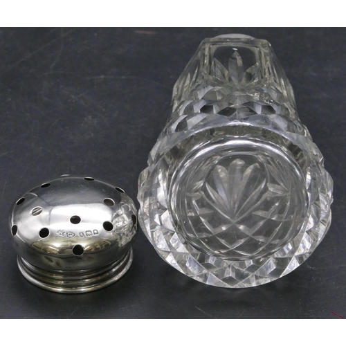 404 - A cut glass silver sugar castor with silver screw lid, 13.5cm high.