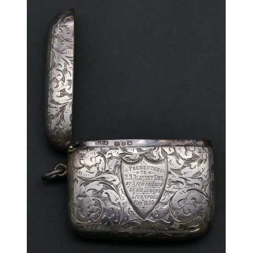 405 - A Victorian silver large vesta case with allover chased floral and scroll decoration, hinged lid, Bi... 