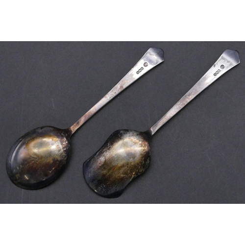 411 - 2 Sheffield silver jam spoons in fitted red leather case.