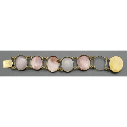 424 - A gilt metal and agate panel bracelet (one panel missing and one cracked).