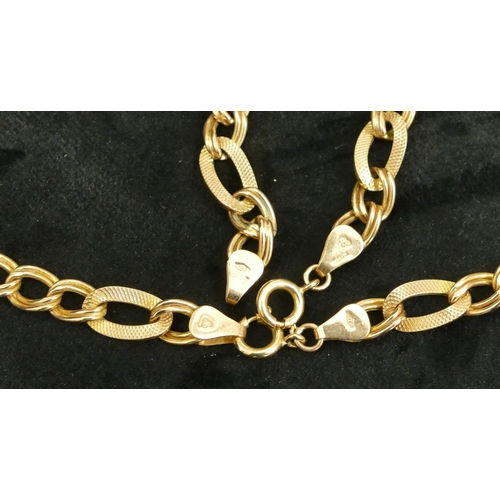 442 - A 9ct gold flat linked chain (1 link a/f) and a similar 9ct gold bracelet, 18.8 grams gross. (2)