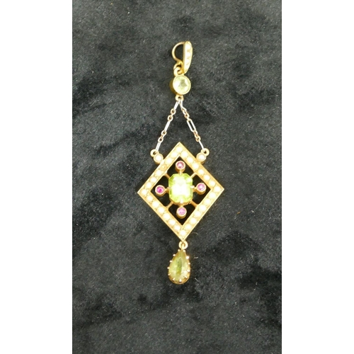 443 - A 15ct gold drop pendant mounted with 3 green stones and 4 red stones and surrounded by half pearls ... 