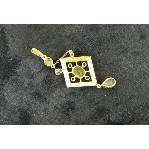 443 - A 15ct gold drop pendant mounted with 3 green stones and 4 red stones and surrounded by half pearls ... 