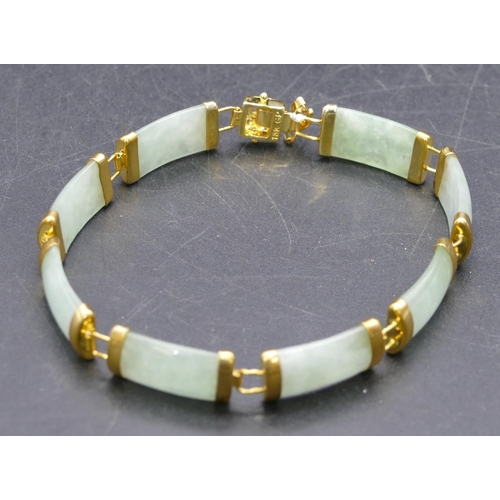 449 - An Oriental jade style panel bracelet, 19.5cm long.