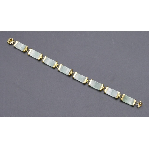 449 - An Oriental jade style panel bracelet, 19.5cm long.