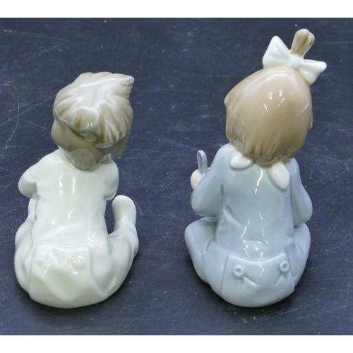 46 - 2 Nao figures of seated babies with bottle and bowl, largest 12.5cm high. (2)