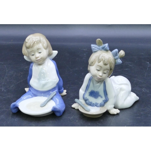 47 - 2 Nao figures of a seated and a crawling baby holding plates, largest 11cm high. (2)