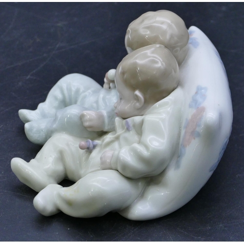 48 - A Lladro group of 2 sleeping babies on a cushion, 14cm wide.