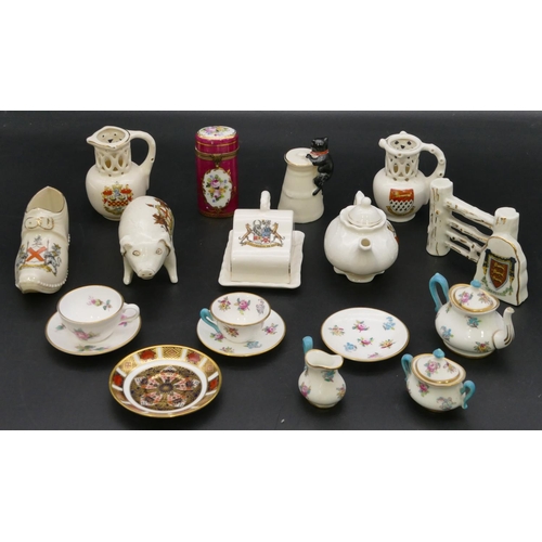 5 - A miniature Crown Staffordshire breakfast set on white and puce ground with multi-coloured floral an... 
