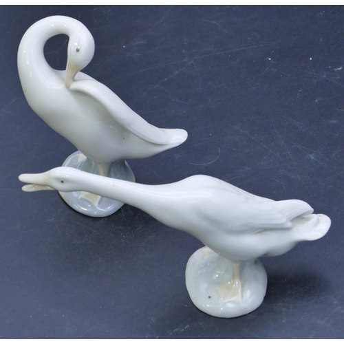 57 - 2 Lladro figures of white geese, largest 10.8cm high. (2)