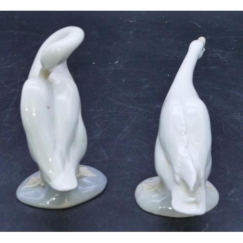 57 - 2 Lladro figures of white geese, largest 10.8cm high. (2)