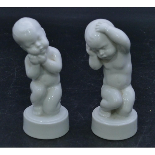 67 - 2 B&G Denmark white china figures of kneeling children on round bases, 11.5cm high. (2)