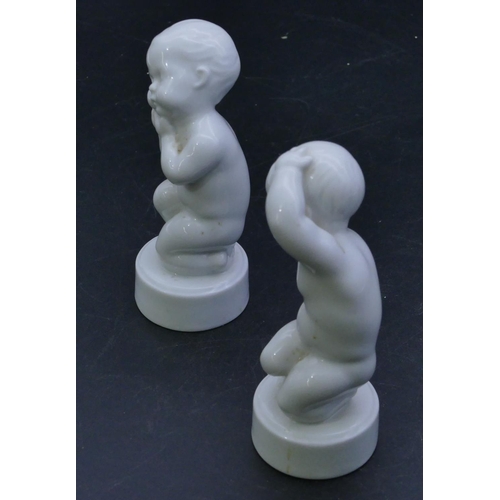 67 - 2 B&G Denmark white china figures of kneeling children on round bases, 11.5cm high. (2)