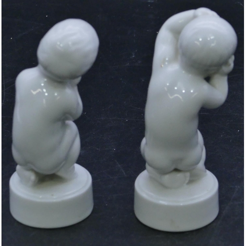 67 - 2 B&G Denmark white china figures of kneeling children on round bases, 11.5cm high. (2)