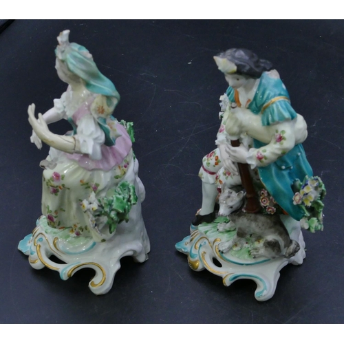 72 - A pair of Derby porcelain figures of seated gentleman and lady with sheep and dog at their feet with... 