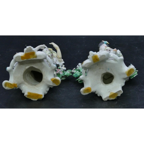 72 - A pair of Derby porcelain figures of seated gentleman and lady with sheep and dog at their feet with... 