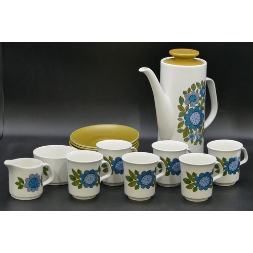 73 - A 1960's Meakin coffee service on white ground with blue and green floral and leaf decoration, 1 cof... 