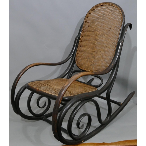 739 - A bentwood rocking chair with cane seat and back (some later screws in stretchers).