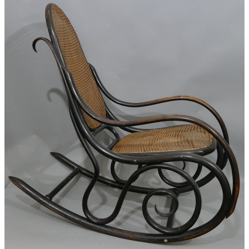 739 - A bentwood rocking chair with cane seat and back (some later screws in stretchers).