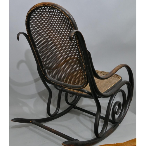 739 - A bentwood rocking chair with cane seat and back (some later screws in stretchers).