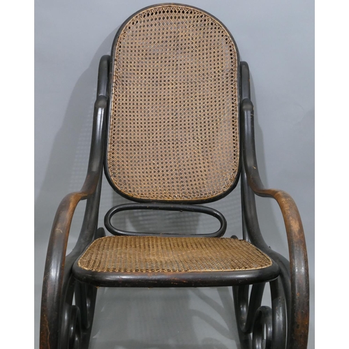 739 - A bentwood rocking chair with cane seat and back (some later screws in stretchers).