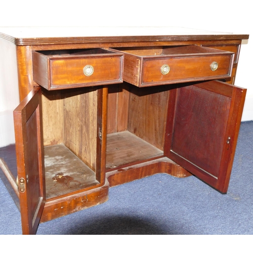 748 - A 19th Century mahogany kneehole writing desk with red inset top, centre drawer flanked by 2 smaller... 